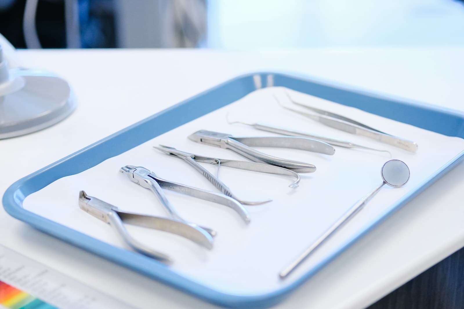 A tray of clean dental instruments laid out ready, sealed and sterilised per instrument