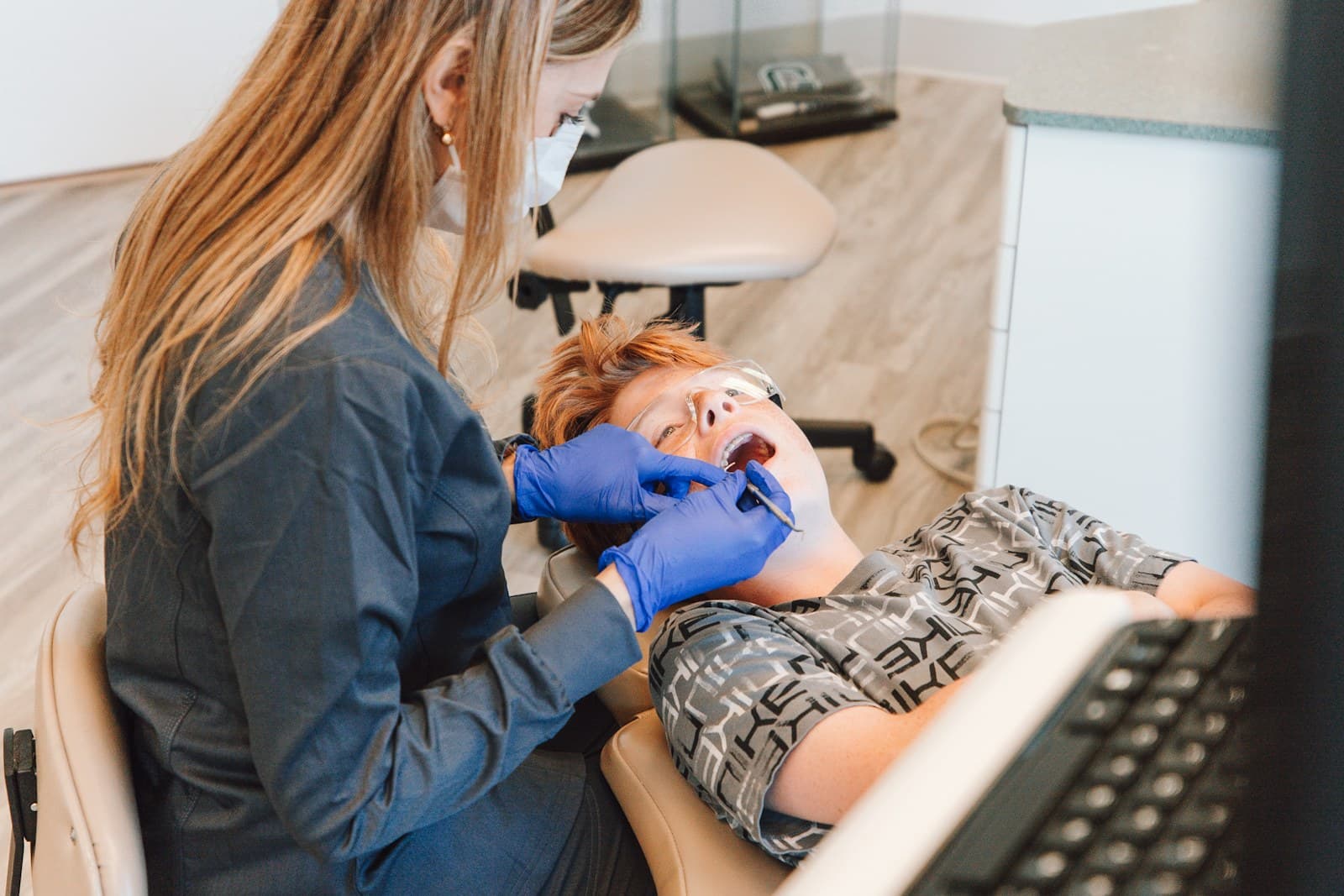 A clinician reviewing digital images with a patient chairside